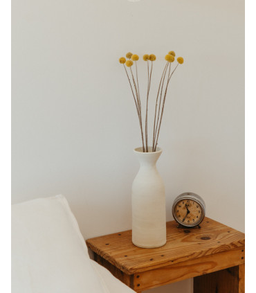 dried yellow craspedia on a table