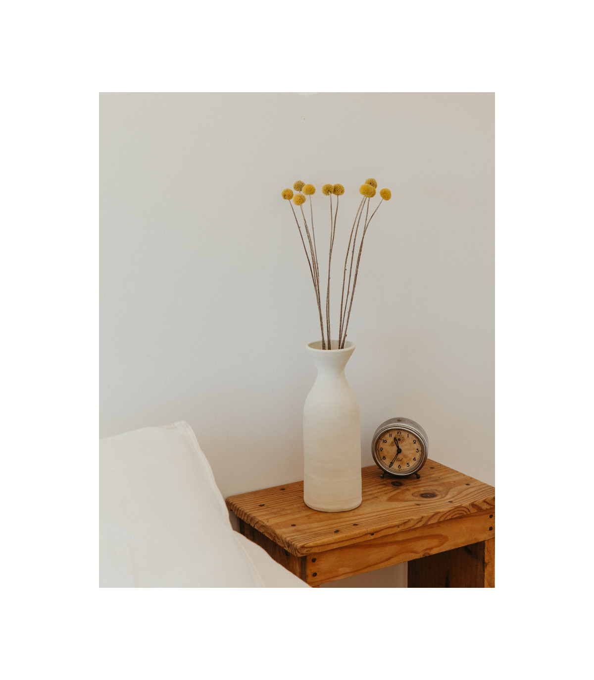 dried yellow craspedia on a table